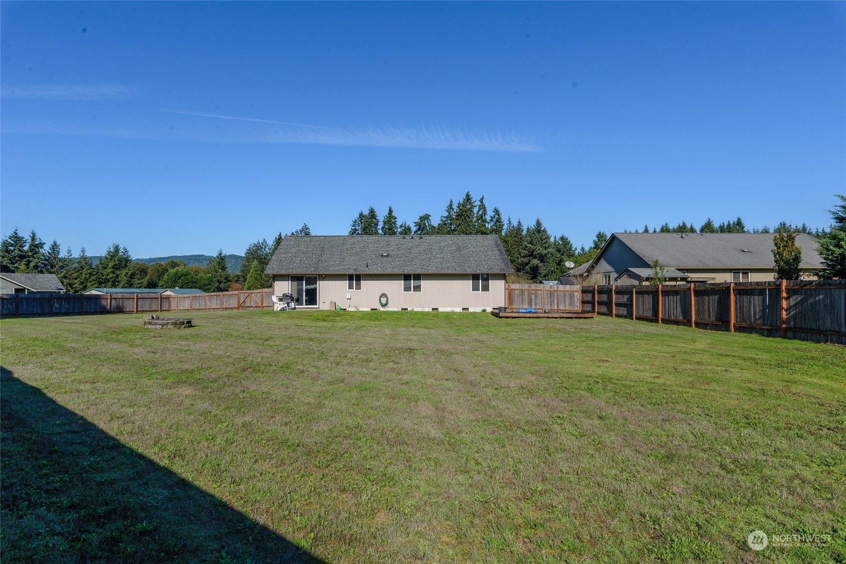 17914 Michelles Lane Southwest Rochester, WA 98579 - Photo 17 of 28 a view of a big house with a big yard and a large tree