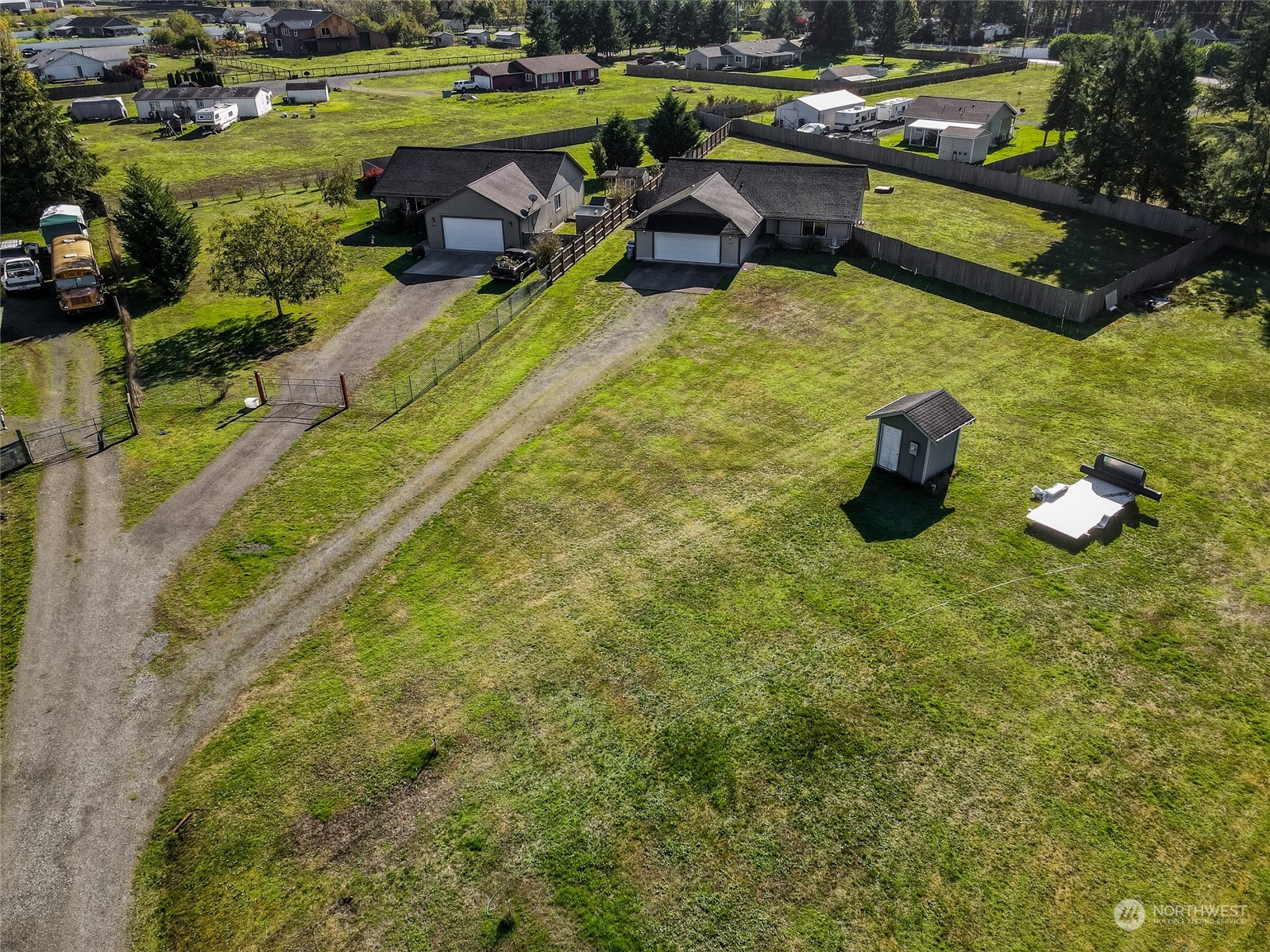 17914 Michelles Lane Southwest Rochester, WA 98579 - Photo 21 of 28 a view of a swimming pool with a bench and lawn chairs