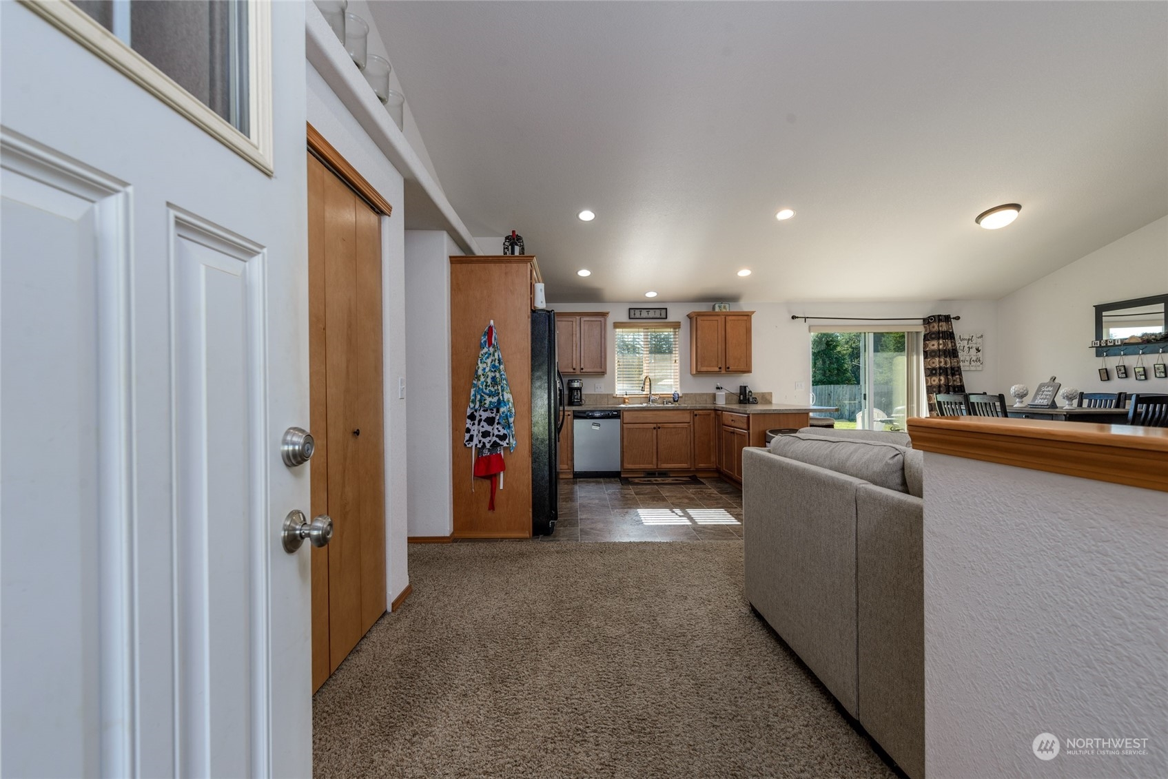 17914 Michelles Lane Southwest Rochester, WA 98579 - Photo 4 of 28 a living room with stainless steel appliances kitchen island granite countertop furniture and a view of kitchen