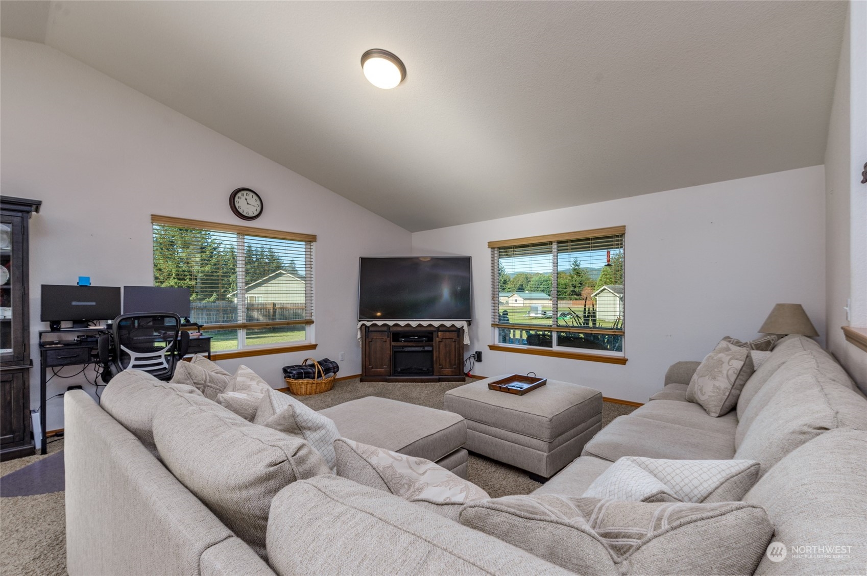 17914 Michelles Lane Southwest Rochester, WA 98579 - Photo 5 of 28 a living room with furniture flat screen tv and a large window