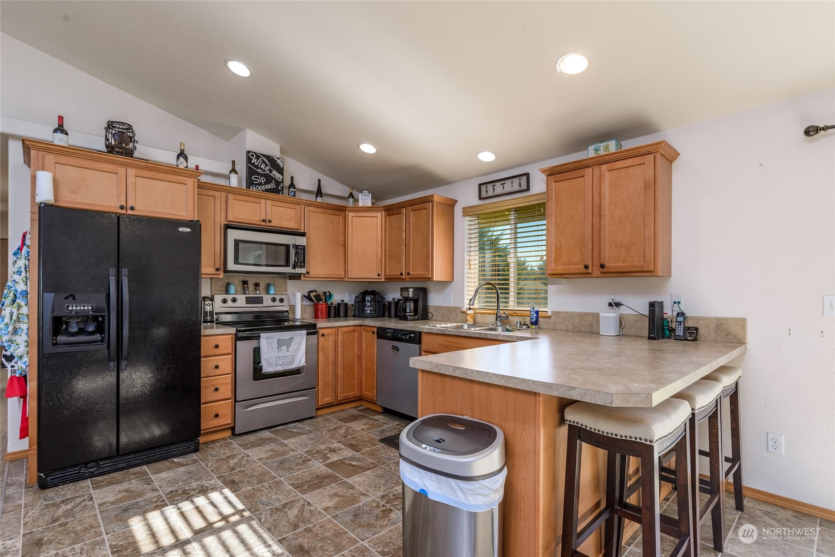17914 Michelles Lane Southwest Rochester, WA 98579 - Photo 7 of 28 a kitchen with granite countertop a sink appliances and cabinets