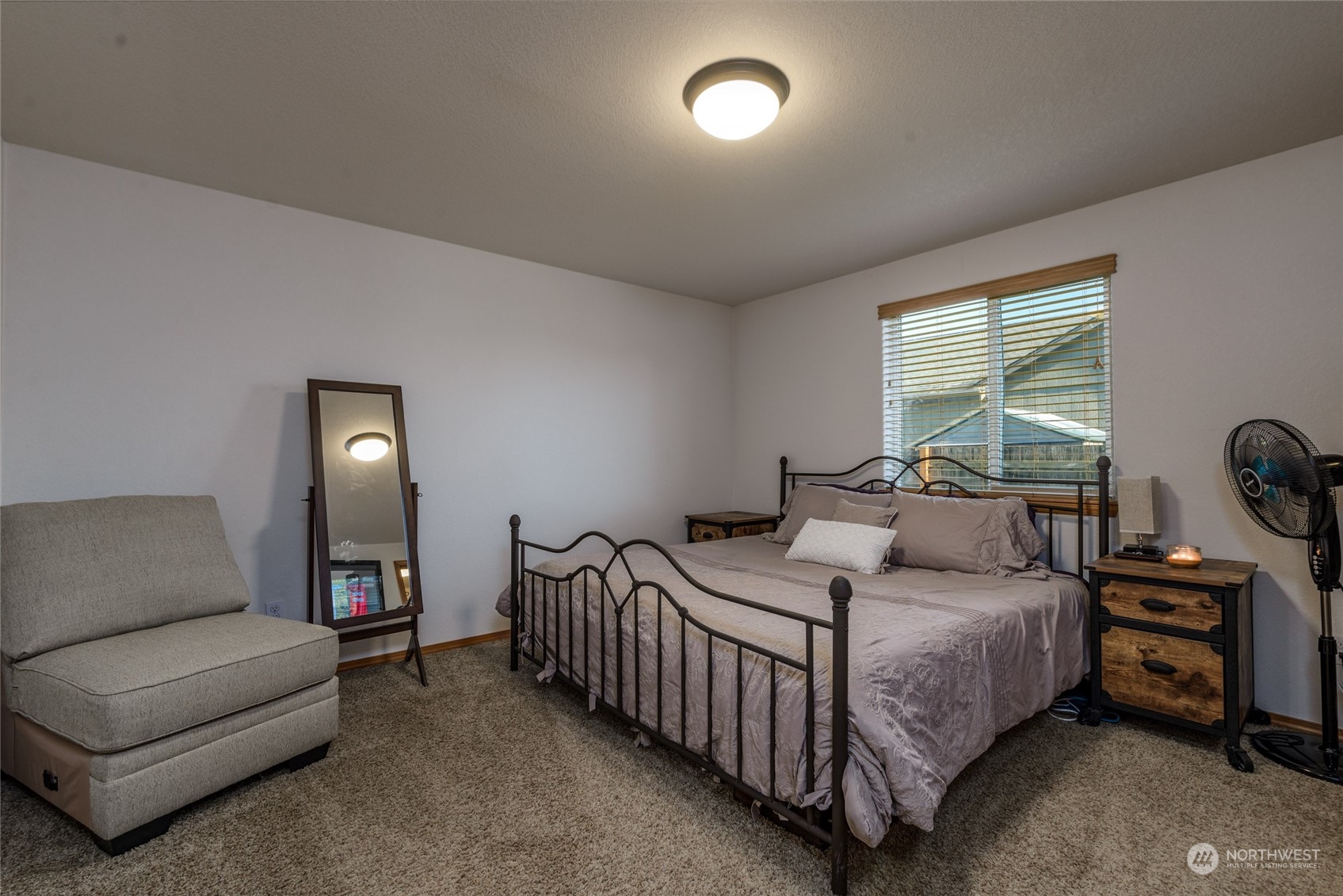 17914 Michelles Lane Southwest Rochester, WA 98579 - Photo 9 of 28 a bedroom with a bed and a couch