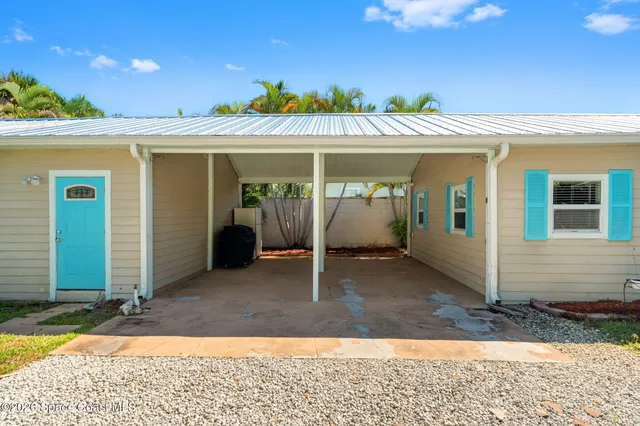 a view of a house with a yard patio and swimming pool
