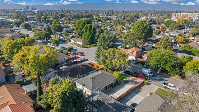 an aerial view of residential houses with outdoor space