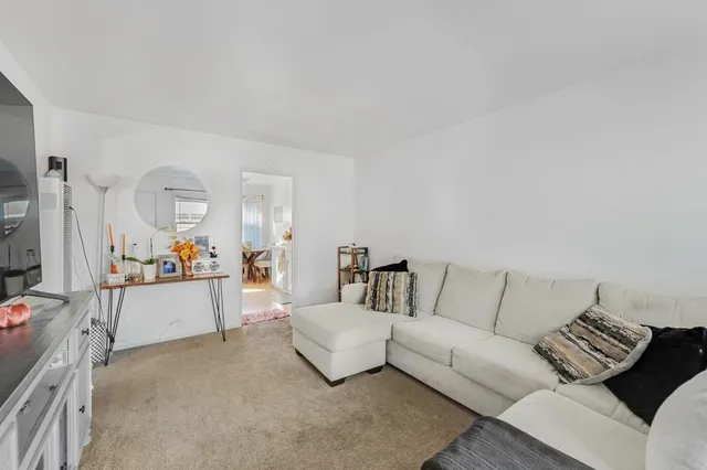 a living room with furniture and a couch