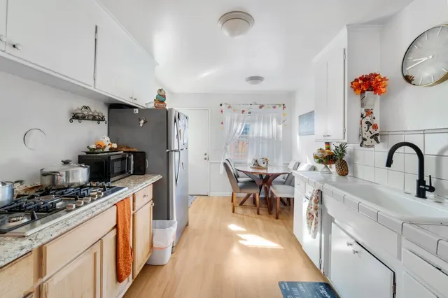 a bathroom with a sink toilet and a mirror