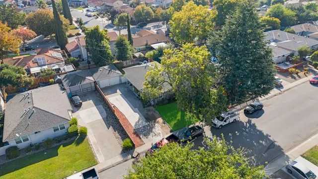 an aerial view of residential houses with outdoor space
