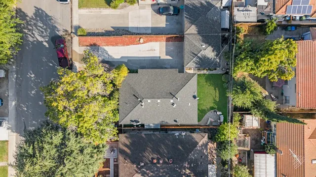 an aerial view of a house with a yard