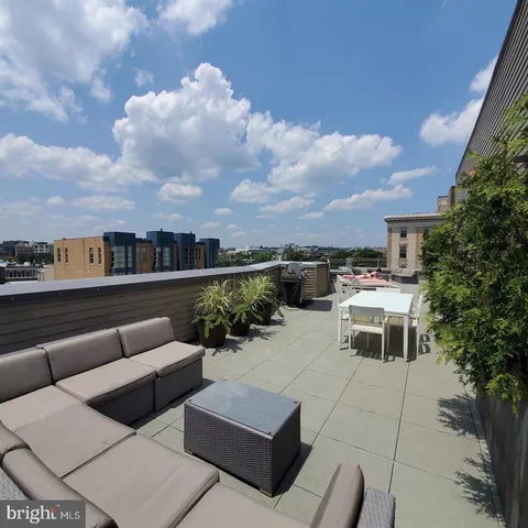 a kitchen view with a car parked in front of it