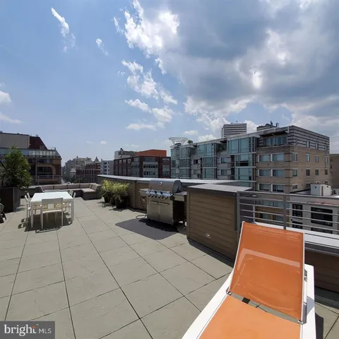 a picture of a bench in front of a microwave