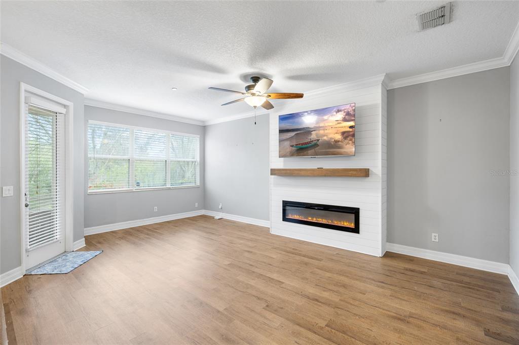 7467 Terrace River Drive Temple Terrace, FL 33637 - Photo 15 of 46 an empty room with windows and fireplace