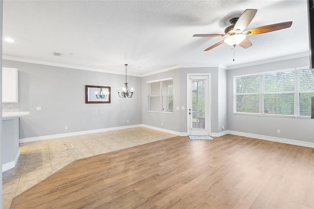 7467 Terrace River Drive Temple Terrace, FL 33637 - Photo 16 of 46 a view of an empty room with a window and wooden floor