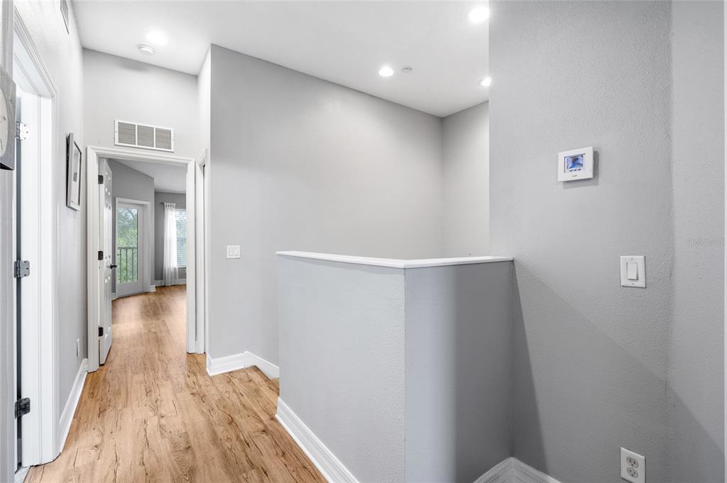 7467 Terrace River Drive Temple Terrace, FL 33637 - Photo 18 of 46 a view of a hallway with wooden floor