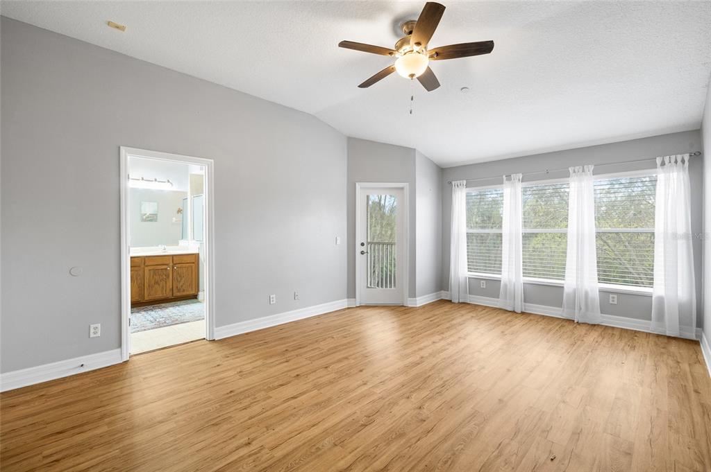 7467 Terrace River Drive Temple Terrace, FL 33637 - Photo 20 of 46 a view of an empty room with wooden floor and a window