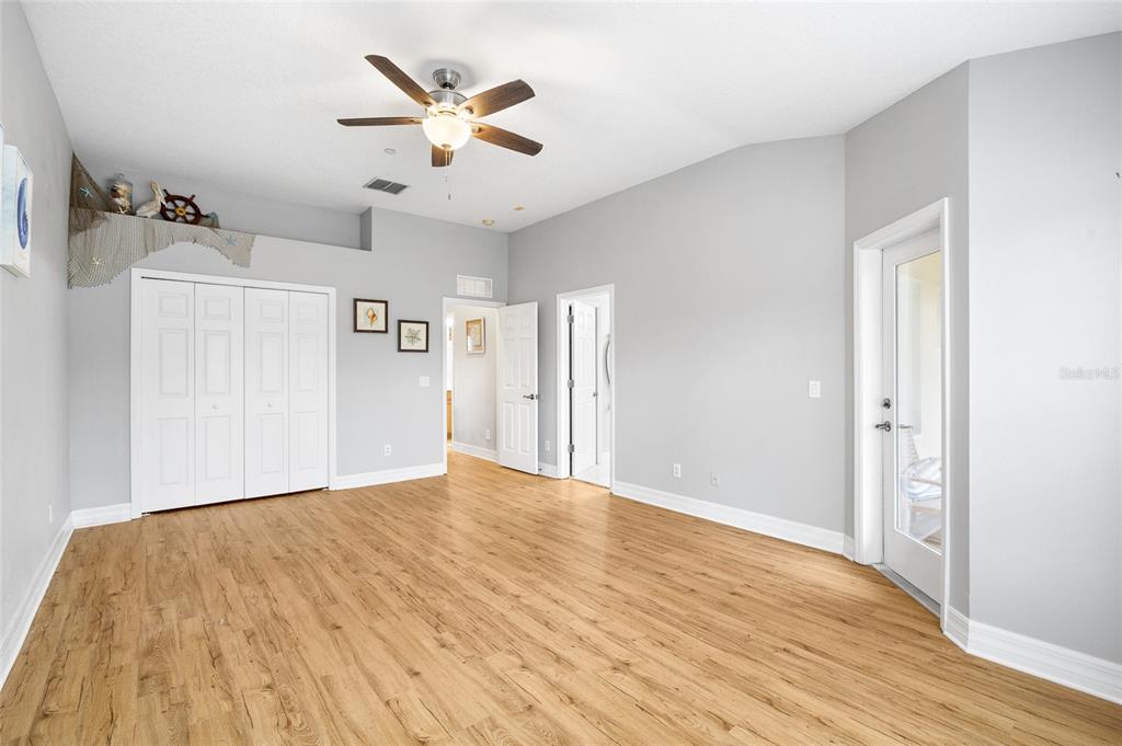 7467 Terrace River Drive Temple Terrace, FL 33637 - Photo 21 of 46 a view of an empty room with wooden floor