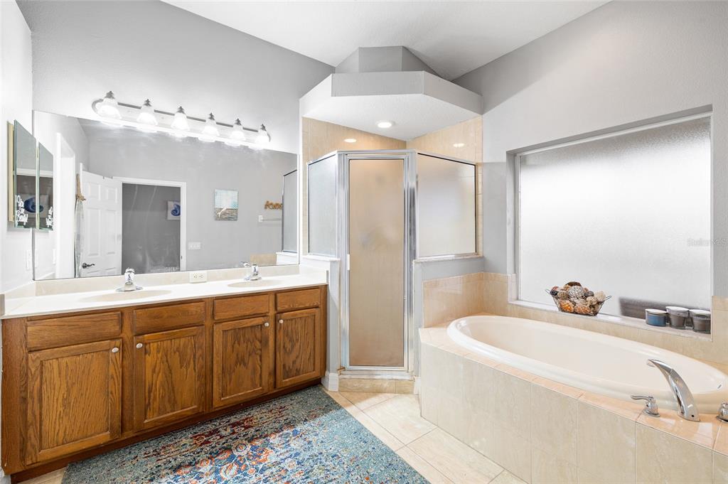 7467 Terrace River Drive Temple Terrace, FL 33637 - Photo 22 of 46 a spacious bathroom with a double vanity sink mirror and double