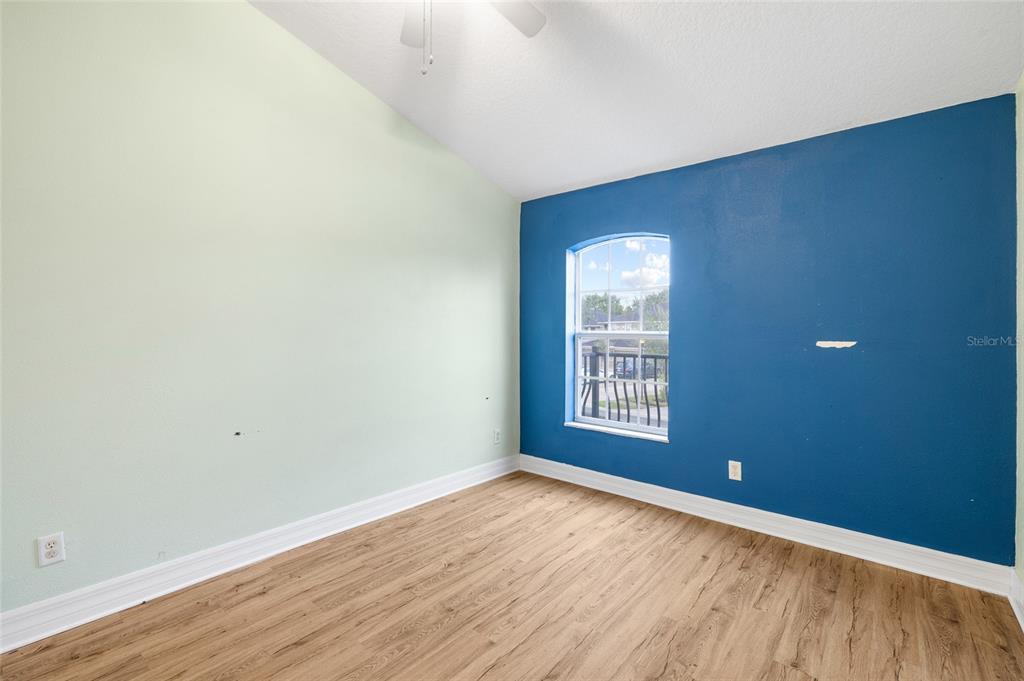 7467 Terrace River Drive Temple Terrace, FL 33637 - Photo 26 of 46 a view of an empty room with wooden floor and a window