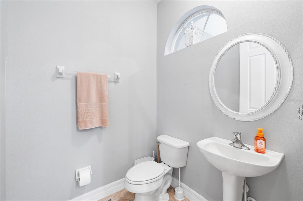 7467 Terrace River Drive Temple Terrace, FL 33637 - Photo 28 of 46 a bathroom with a sink mirror and toilet
