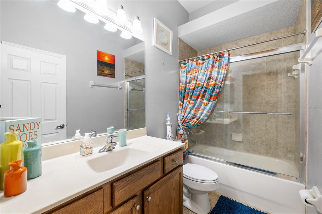 7467 Terrace River Drive Temple Terrace, FL 33637 - Photo 31 of 46 a bathroom with a sink a toilet and shower