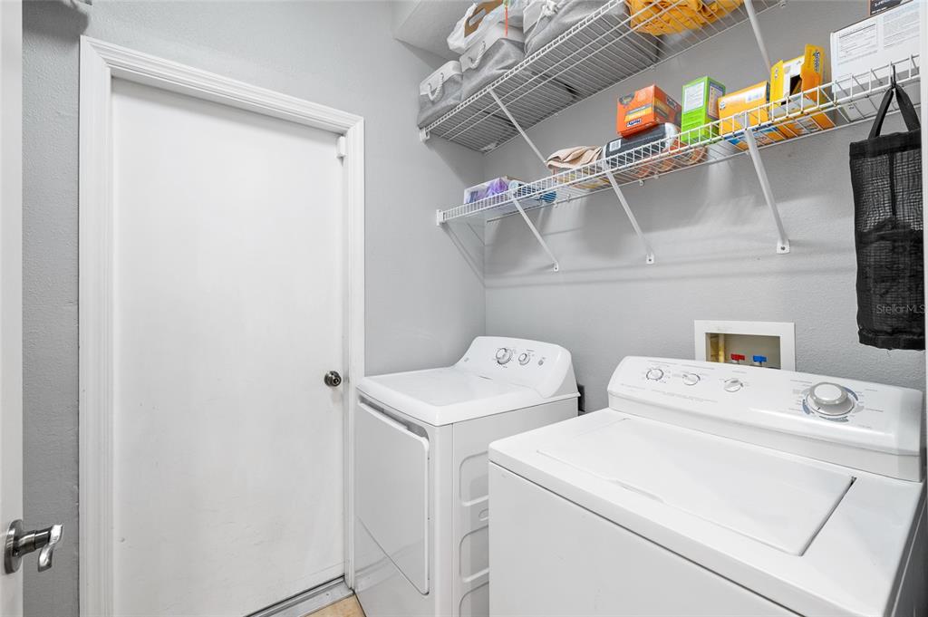 7467 Terrace River Drive Temple Terrace, FL 33637 - Photo 32 of 46 a utility room with dryer and washer