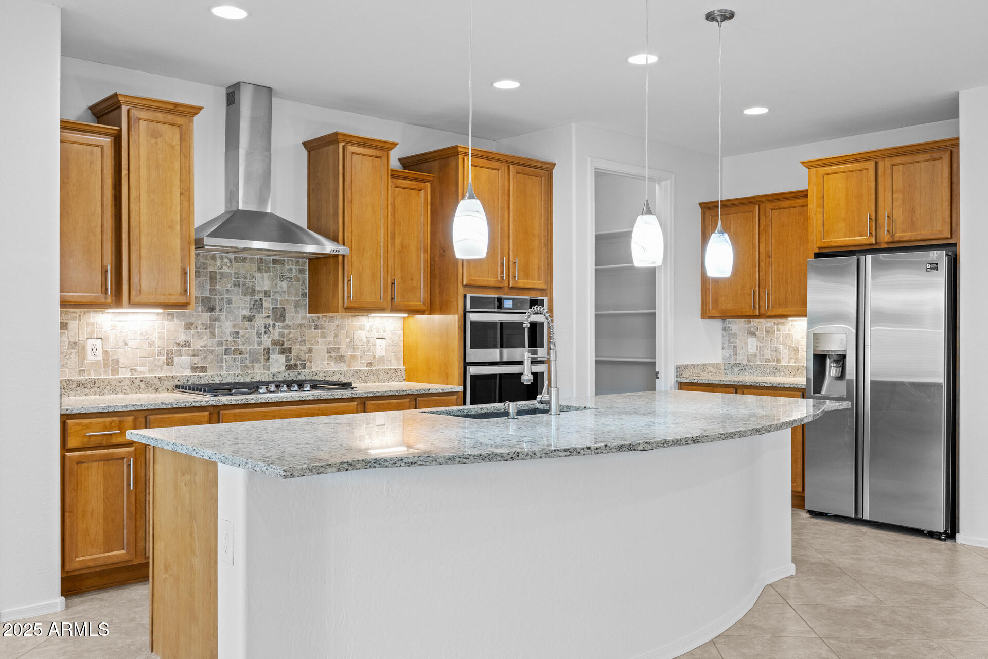 8160 West Cinder Brook Way Florence, AZ 85132 - Photo 13 of 81 a kitchen with stainless steel appliances granite countertop a sink and a refrigerator