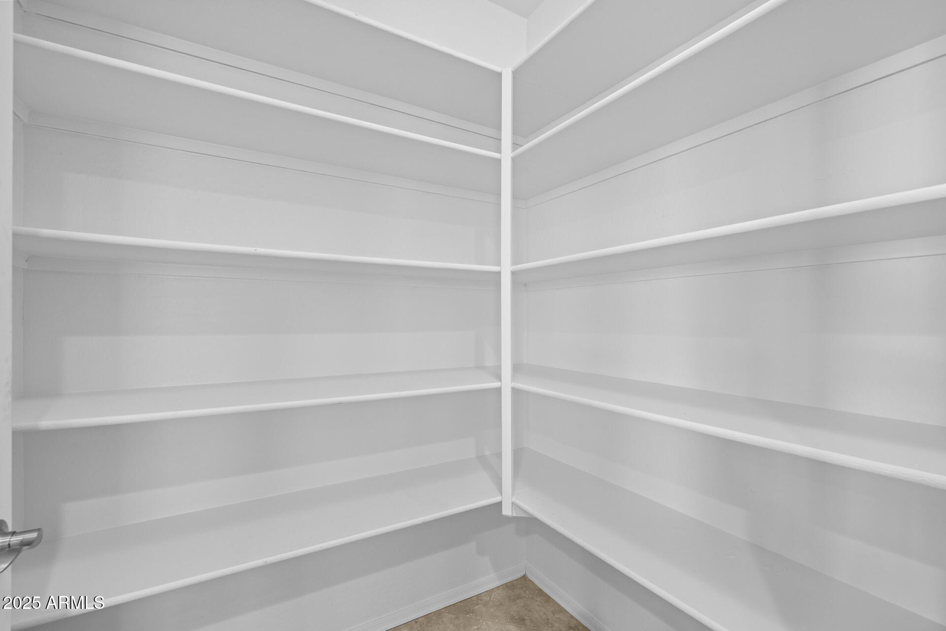 8160 West Cinder Brook Way Florence, AZ 85132 - Photo 27 of 81 a view of walk in closet with empty racks