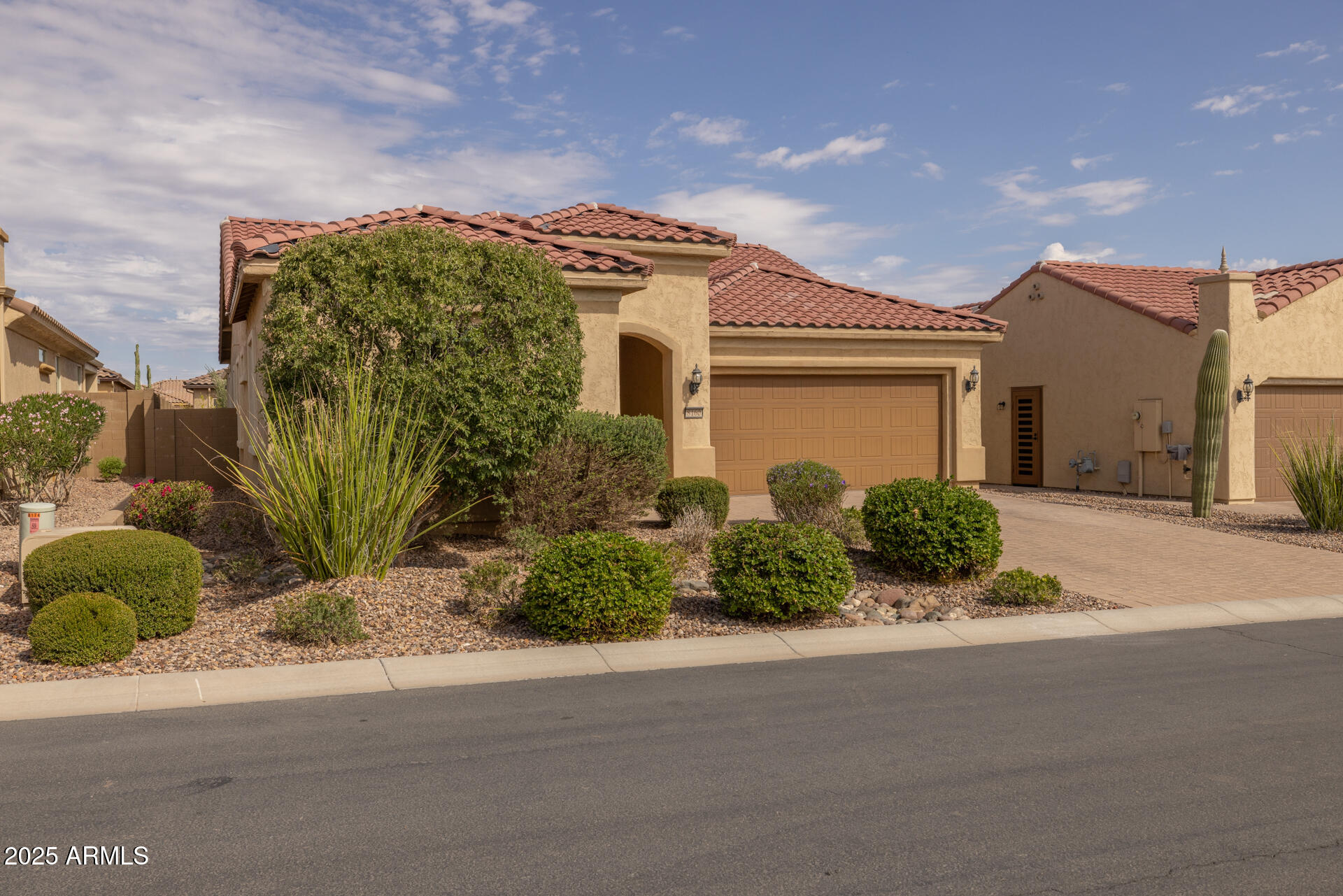 8160 West Cinder Brook Way Florence, AZ 85132 - Photo 2 of 81 a front view of a house with a garden