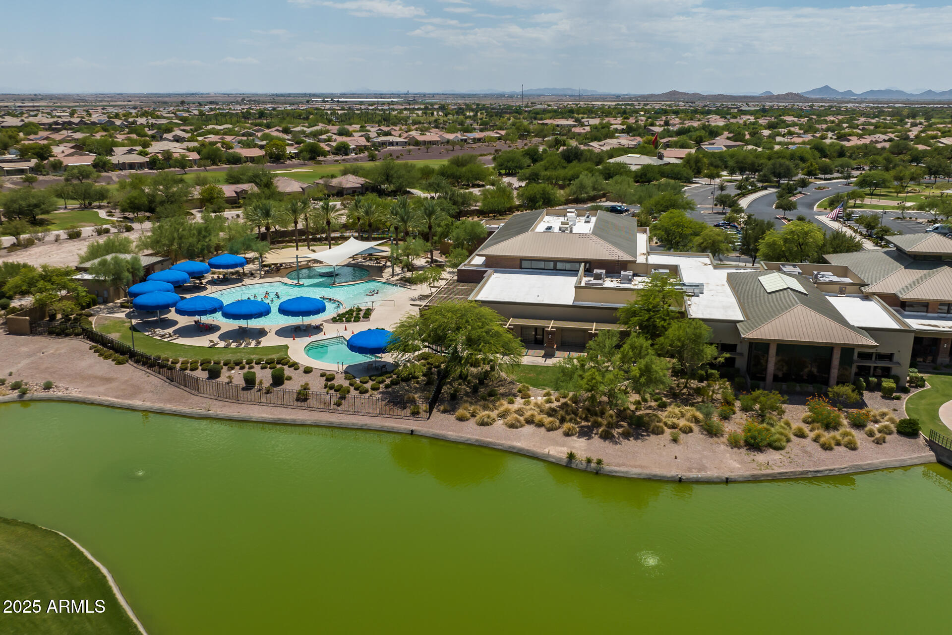 8160 West Cinder Brook Way Florence, AZ 85132 - Photo 61 of 81 an aerial view of a house with a garden and lake view
