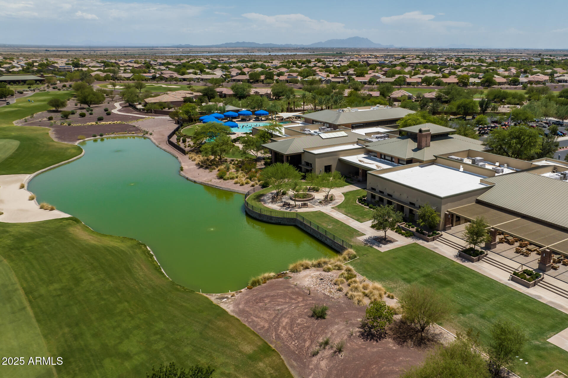 8160 West Cinder Brook Way Florence, AZ 85132 - Photo 62 of 81 an aerial view of a house with a lake