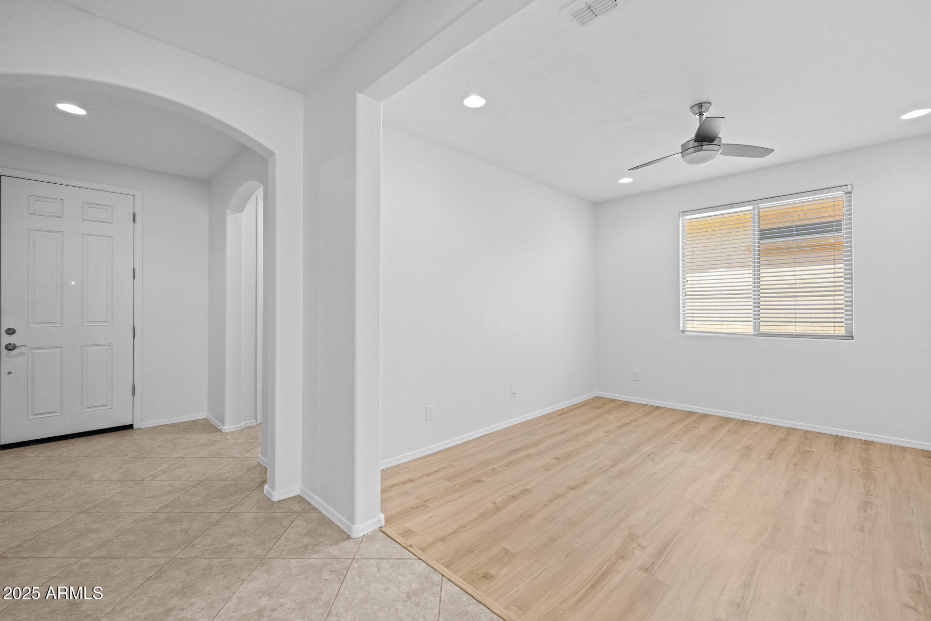 8160 West Cinder Brook Way Florence, AZ 85132 - Photo 5 of 81 an empty room with windows and cabinet