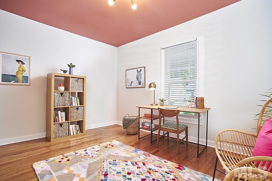 2203 Chapel Hill Road Durham, NC 27707 - Photo 23 of 37 a bedroom with furniture and a wooden floor