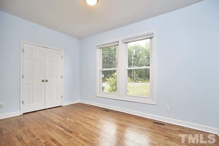 2203 Chapel Hill Road Durham, NC 27707 - Photo 26 of 37 a view of an empty room with wooden floor and a window