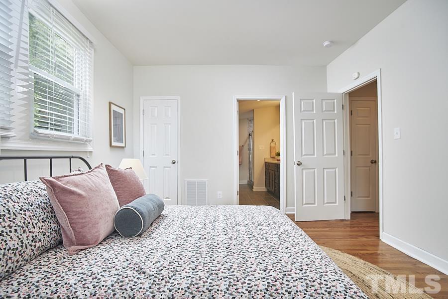 2203 Chapel Hill Road Durham, NC 27707 - Photo 29 of 37 a bedroom with a bed and a window