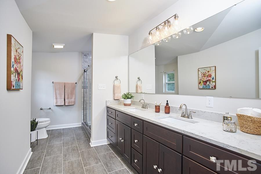 2203 Chapel Hill Road Durham, NC 27707 - Photo 30 of 37 a spacious bathroom with a sink double vanity granite and a mirror