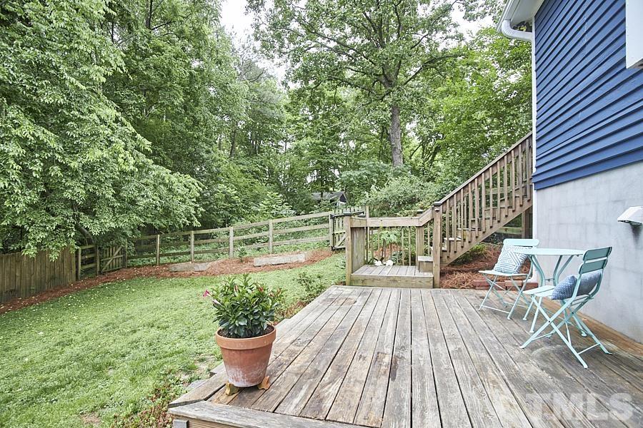2203 Chapel Hill Road Durham, NC 27707 - Photo 35 of 37 a view of a deck with chair and wooden floor