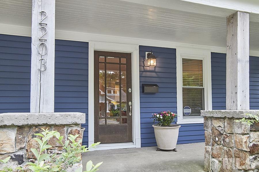 2203 Chapel Hill Road Durham, NC 27707 - Photo 4 of 37 a view of a door of the house with potted plants
