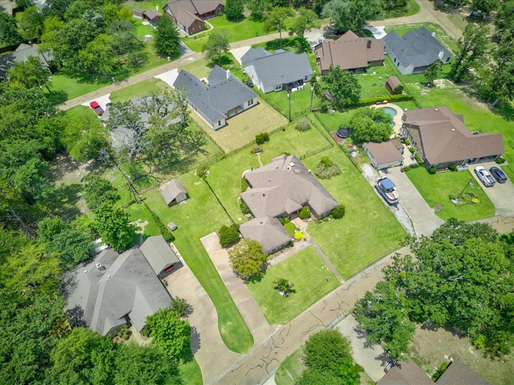 111 Trailwood Road Enchanted Oaks, TX 75156 - Photo 29 of 33 an aerial view of a house with a garden