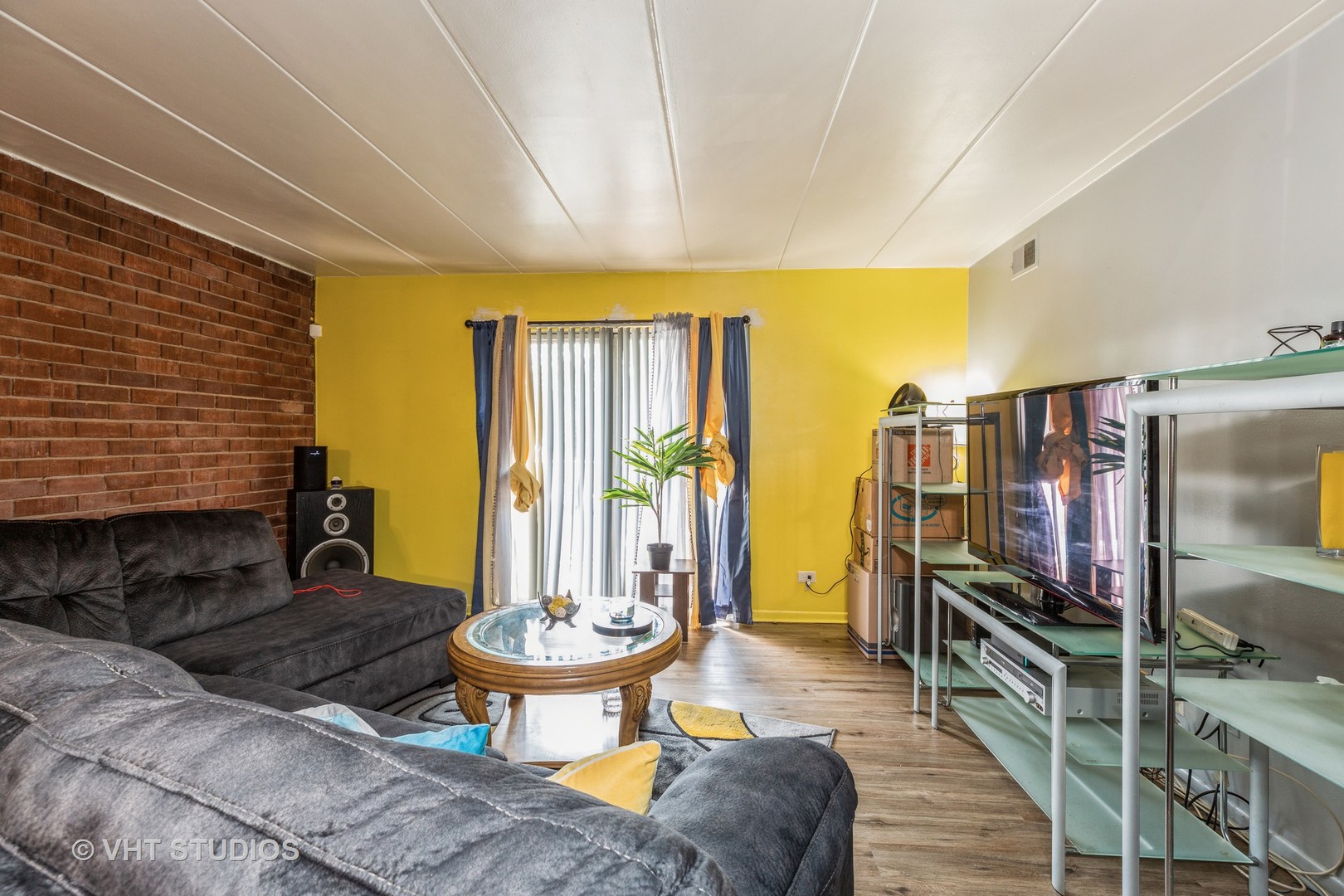 17001 Albany Avenue, Unit 101 Hazel Crest, IL 60429 - Photo 2 of 10 a living room with furniture and a floor to ceiling window
