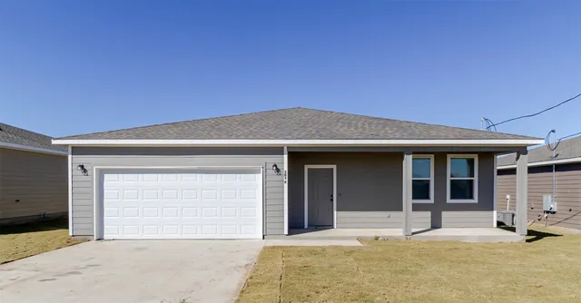 a house with yard in front of it
