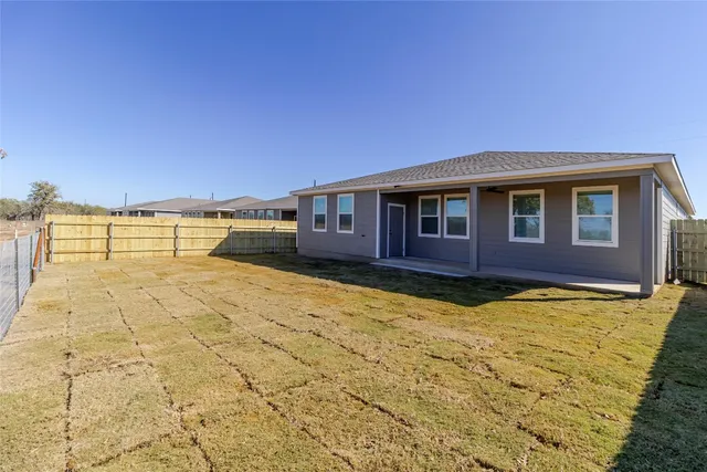 a view of a yard with an ocean view