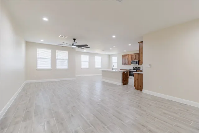a view of kitchen with wooden floor and windows