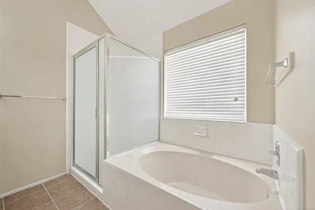 a white bath tub sitting next to a white sink
