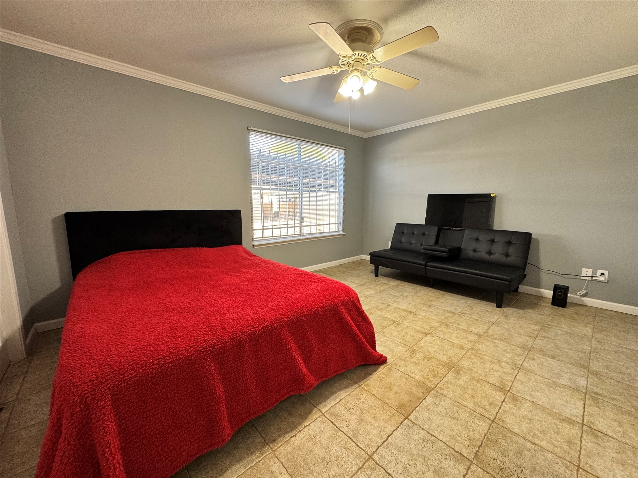 6001 Reims Road, Unit 309 Houston, TX 77036 - Photo 15 of 23 a spacious bedroom with a bed and a chandelier