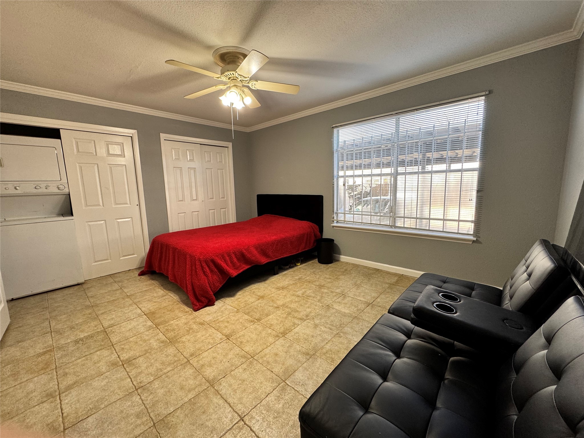 6001 Reims Road, Unit 309 Houston, TX 77036 - Photo 17 of 23 a bedroom with a bed and window