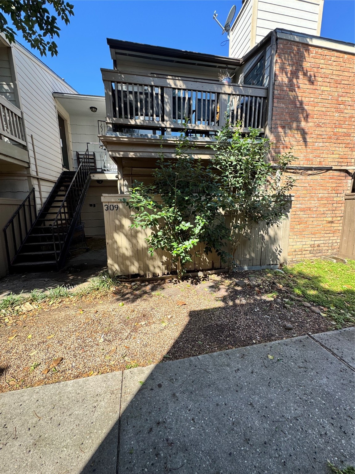 6001 Reims Road, Unit 309 Houston, TX 77036 - Photo 2 of 23 a view of a house with a yard