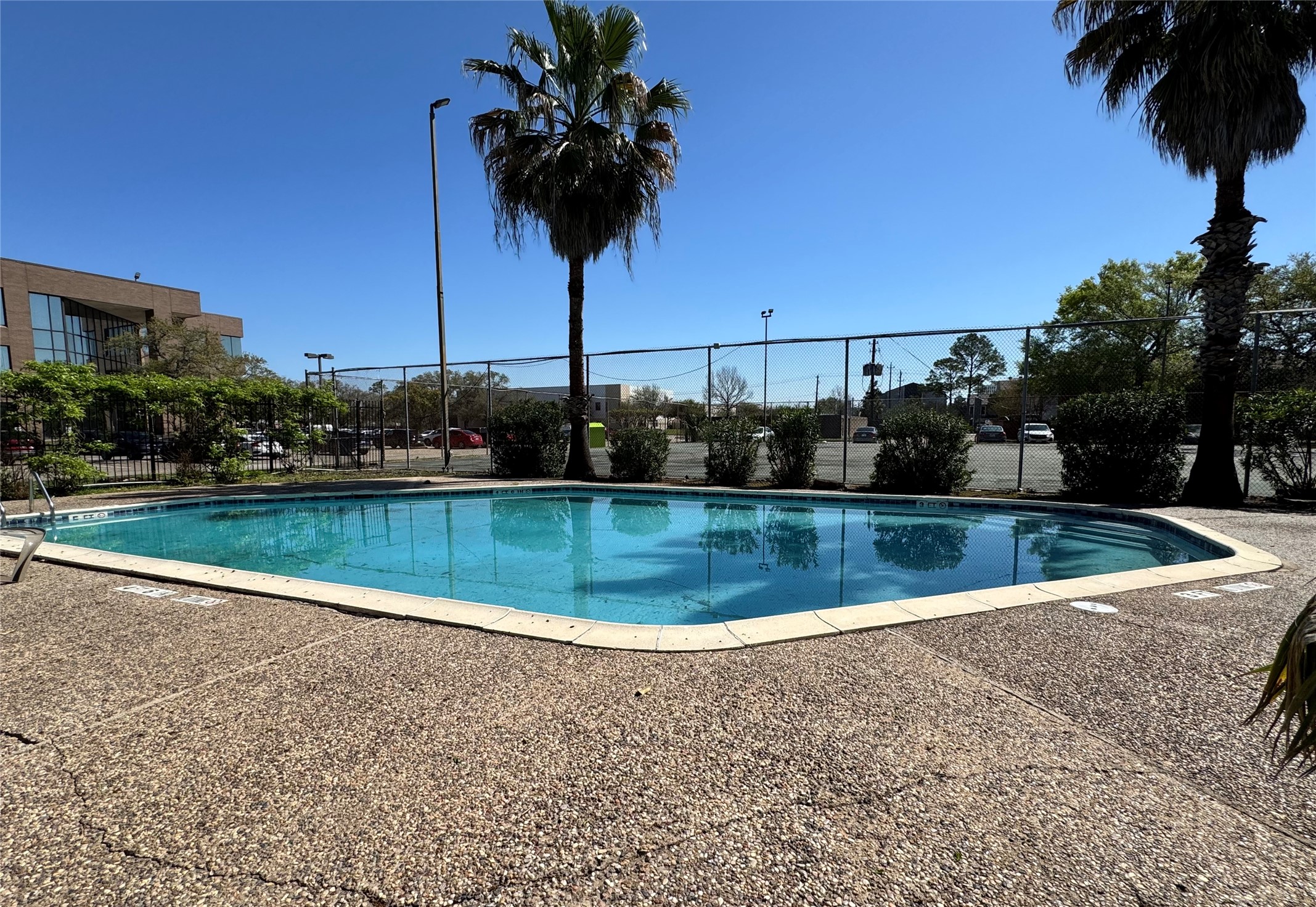 6001 Reims Road, Unit 309 Houston, TX 77036 - Photo 22 of 23 a view of a swimming pool with a yard
