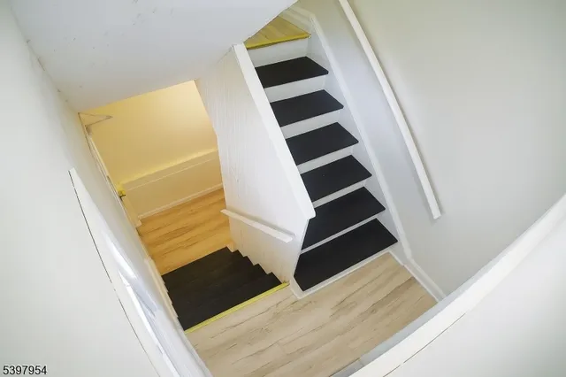 an entryway in a house with wooden floor