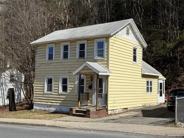 a view of a house and a yard