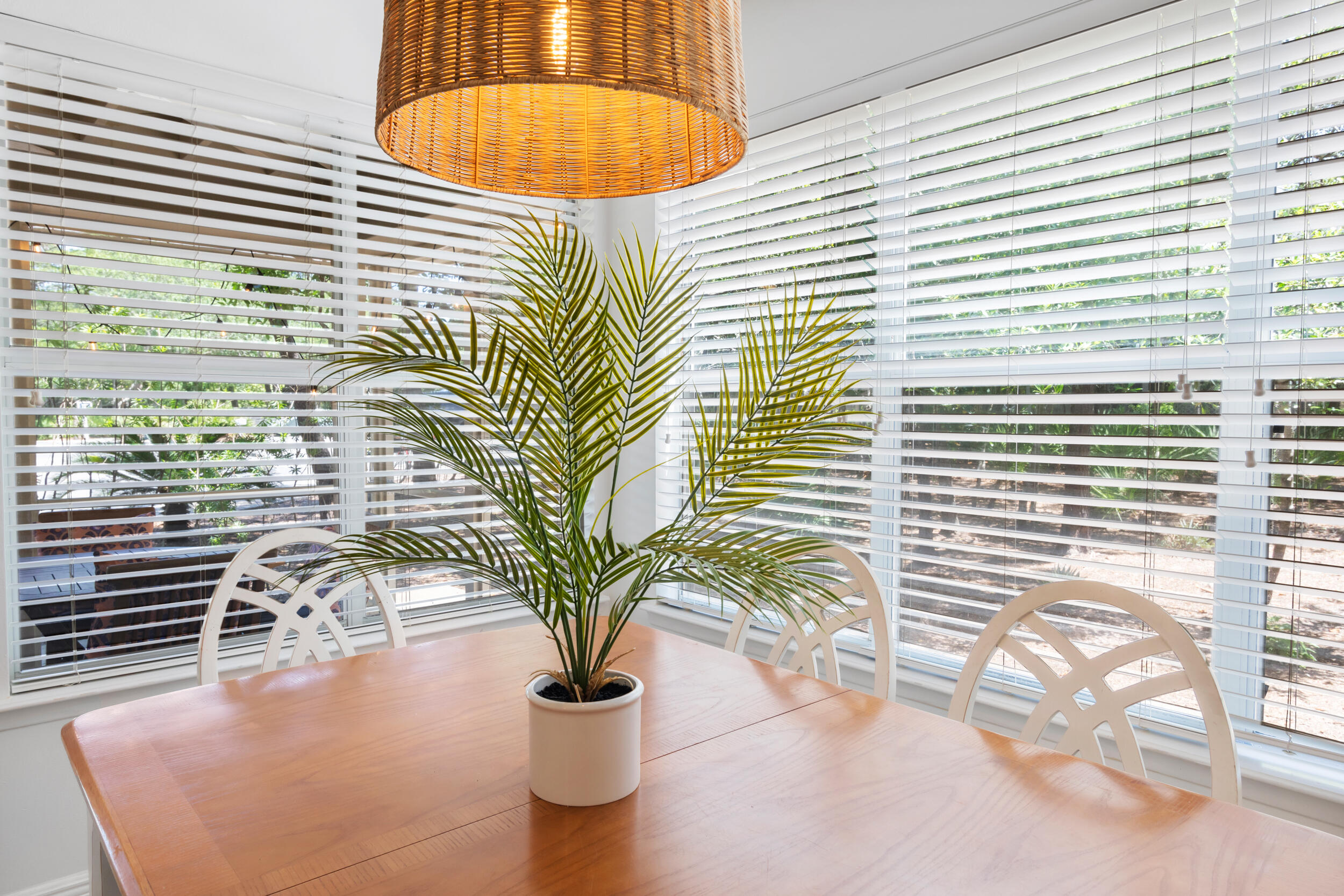 9815 Highway 98, Unit 144 Miramar Beach, FL 32550 - Photo 12 of 70 a vase of flowers sitting on a table in front of a house