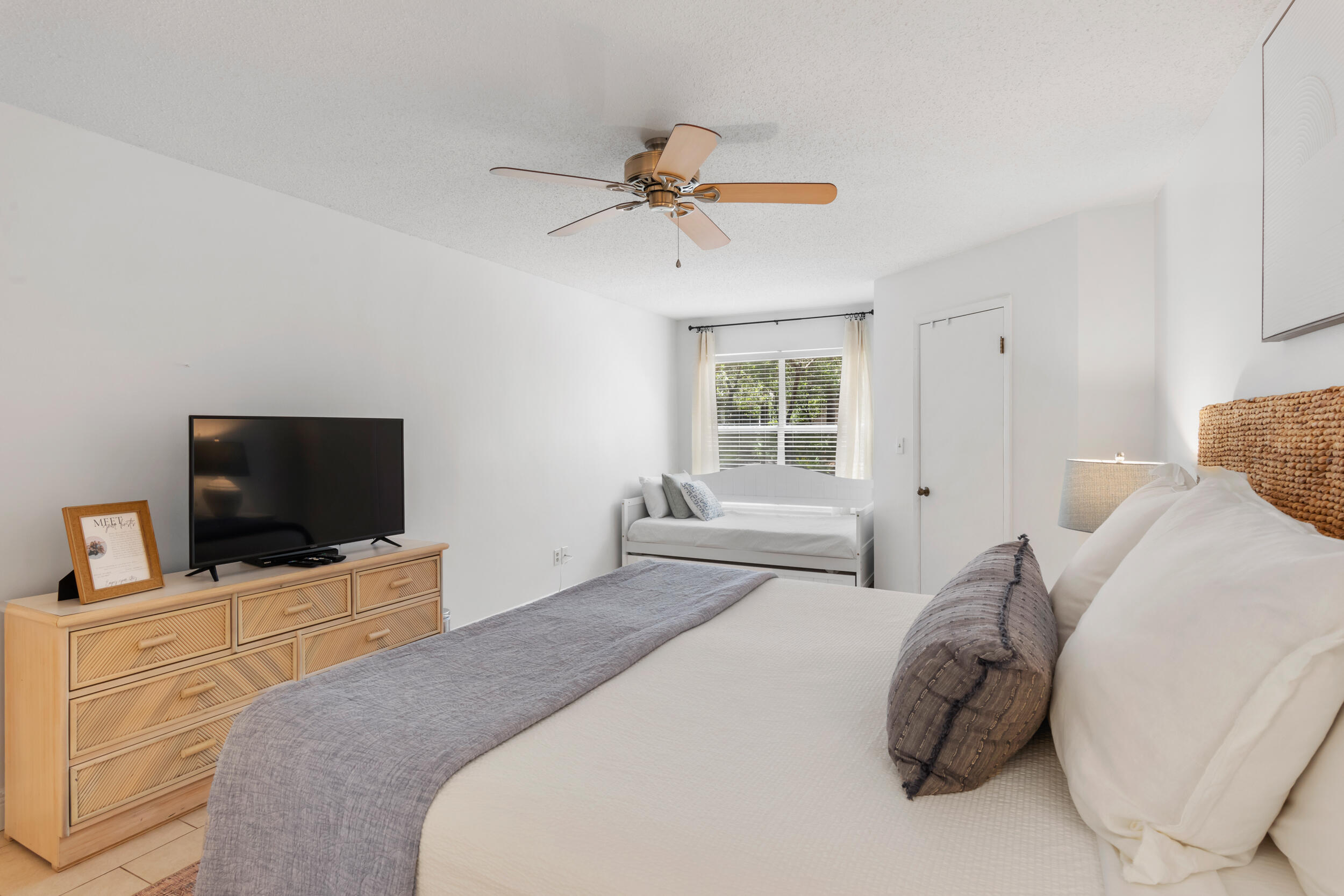 9815 Highway 98, Unit 144 Miramar Beach, FL 32550 - Photo 19 of 70 a bedroom with a bed and a flat screen tv
